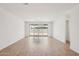 Spacious living room with tile floors and sliding glass doors to the outside at 18248 W La Senda Dr, Surprise, AZ 85387