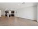 Open concept living room featuring wood floors and direct access to kitchen at 18248 W La Senda Dr, Surprise, AZ 85387