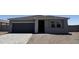 Beautiful single-story home featuring a gray exterior, a two-car garage, and desert landscaping at 18269 W Camino De Oro --, Surprise, AZ 85387