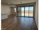 Bright and open living space with tile floors and large glass sliding doors at 18269 W Camino De Oro --, Surprise, AZ 85387