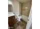 Bathroom featuring tiled shower/tub combo, modern fixtures, and storage vanity at 1841 N Wilbur Cir, Mesa, AZ 85201