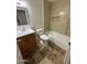 Bathroom boasts tiled floors, vanity sink, and a tiled tub/shower combo at 1841 N Wilbur Cir, Mesa, AZ 85201