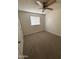 Bedroom features carpet flooring, ceiling fan and a window at 1841 N Wilbur Cir, Mesa, AZ 85201