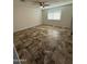 Bedroom featuring tiled flooring, ceiling fan and bright window at 1841 N Wilbur Cir, Mesa, AZ 85201