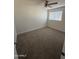 Bedroom featuring neutral carpet, ceiling fan, and window with blinds at 1841 N Wilbur Cir, Mesa, AZ 85201