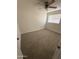 Bright bedroom with neutral carpet, a ceiling fan, and a window at 1841 N Wilbur Cir, Mesa, AZ 85201