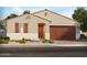 Inviting single-story home showcasing desert landscaping and a private two-car garage at 189 N 175Th Ave, Goodyear, AZ 85338