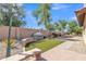 View of the private landscaped backyard featuring artificial turf and patio at 2652 N 143Rd Dr, Goodyear, AZ 85395