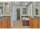 Bright bathroom with double sinks, a soaking tub, and a separate shower at 2652 N 143Rd Dr, Goodyear, AZ 85395
