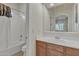 This bathroom features a tub/shower combination, and single sink vanity at 2652 N 143Rd Dr, Goodyear, AZ 85395