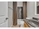 Bathroom featuring a gray countertop, wooden cabinets, tub and patterned shower curtain with a towel rack at 2652 N 143Rd Dr, Goodyear, AZ 85395
