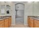 Bathroom featuring double sinks and an arched doorway to another room at 2652 N 143Rd Dr, Goodyear, AZ 85395