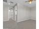 This bedroom offers neutral carpeting, ceiling fan and ensuite bathroom for added comfort at 2652 N 143Rd Dr, Goodyear, AZ 85395