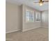 Bedroom featuring neutral tones, carpet, natural light from shuttered windows, and a ceiling fan at 2652 N 143Rd Dr, Goodyear, AZ 85395