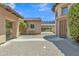 Charming courtyard featuring decorative pavers, private bench, and lush greenery at 2652 N 143Rd Dr, Goodyear, AZ 85395