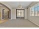 Dining room with carpeted floor, decorative chandelier, and a window with shutters and views at 2652 N 143Rd Dr, Goodyear, AZ 85395
