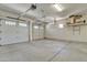 Spacious three car garage with auto door openers and overhead lighting at 2652 N 143Rd Dr, Goodyear, AZ 85395