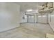 Spacious three car garage with auto door openers, shelving and overhead lighting at 2652 N 143Rd Dr, Goodyear, AZ 85395