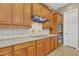 Well-appointed kitchen with ample cabinetry, modern appliances, and a sleek cooktop at 2652 N 143Rd Dr, Goodyear, AZ 85395