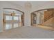 View of the open-concept living spaces showing the kitchen, dining, and living room areas at 2652 N 143Rd Dr, Goodyear, AZ 85395