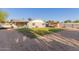 Expansive backyard featuring a well-maintained lawn and gravel area at 332 S 83Rd Pl, Mesa, AZ 85208