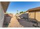 Backyard view showing gravel, partial landscaping, fence and shed at 332 S 83Rd Pl, Mesa, AZ 85208