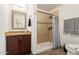 This traditional-style bathroom has an updated shower at 332 S 83Rd Pl, Mesa, AZ 85208