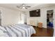 This light-filled bedroom features hardwood floors and ample closet space at 332 S 83Rd Pl, Mesa, AZ 85208