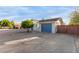 Attractive home featuring a long driveway and blue accents, creating curb appeal at 332 S 83Rd Pl, Mesa, AZ 85208