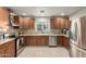This updated kitchen boasts stainless steel appliances and granite countertops at 332 S 83Rd Pl, Mesa, AZ 85208