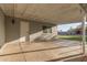 Outdoor patio featuring cement flooring, brick walls, and a window looking into the home at 332 S 83Rd Pl, Mesa, AZ 85208