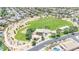 Aerial view of a community park with playground, green fields, and walking paths nestled among residential homes at 3898 E Palmer St, Gilbert, AZ 85298