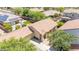 Beautiful aerial view of a home featuring lush landscaping, a private pool, and a well-maintained lawn at 3898 E Palmer St, Gilbert, AZ 85298