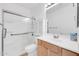Bathroom features a shower with glass doors, vanity, cabinet, sink, faucet and toilet at 3898 E Palmer St, Gilbert, AZ 85298
