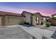 Charming single-story home featuring a tile roof and a two-car garage at sunset at 3898 E Palmer St, Gilbert, AZ 85298