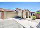 Charming single-story home boasting desert landscaping, a two-car garage, and inviting entryway at 3898 E Palmer St, Gilbert, AZ 85298