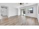 Spacious living room with sliding glass door, wood floors, and barn door at 3898 E Palmer St, Gilbert, AZ 85298