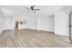Open-concept floor plan with wood floors and views to kitchen at 3898 E Palmer St, Gilbert, AZ 85298