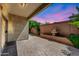 Covered patio featuring beautiful pavers, a serene fountain, and lush landscaping for outdoor enjoyment at 3898 E Palmer St, Gilbert, AZ 85298