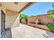 Covered patio featuring beautiful pavers, a serene fountain, and lush landscaping for outdoor enjoyment at 3898 E Palmer St, Gilbert, AZ 85298