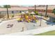 Charming community playground with multiple slides, climbing structures, and shaded seating areas for families to enjoy at 3898 E Palmer St, Gilbert, AZ 85298