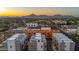 Stunning aerial view of new homes in a suburban community with dramatic mountain backdrop at 4220 N 32Nd St # 14, Phoenix, AZ 85018