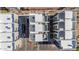 A bird's-eye view of modern townhouses showcasing private rooftop terraces with a relaxing hot tub and sleek parking areas at 4220 N 32Nd St # 14, Phoenix, AZ 85018