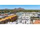 A beautiful aerial view of the apartment complex with picturesque mountain views in the distance, on a sunny day at 4220 N 32Nd St # 14, Phoenix, AZ 85018