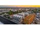 Aerial shot showcasing modern townhomes with balconies, enhancing the property's appeal with a lively cityscape backdrop at 4220 N 32Nd St # 14, Phoenix, AZ 85018