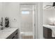 Bright bathroom features a glass-enclosed shower adjacent to the sleek vanity at 4220 N 32Nd St # 14, Phoenix, AZ 85018