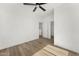 Clean and spacious bedroom with hardwood floors, ceiling fan, and natural light at 4220 N 32Nd St # 14, Phoenix, AZ 85018