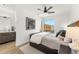Bright bedroom featuring a ceiling fan and an outside view at 4220 N 32Nd St # 14, Phoenix, AZ 85018
