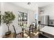 Modern dining area with stainless steel refrigerator and a large bright window at 4220 N 32Nd St # 14, Phoenix, AZ 85018