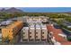 Modern townhomes with stylish facades, neutral tones, and well-manicured landscaping against a clear sky at 4220 N 32Nd St # 14, Phoenix, AZ 85018